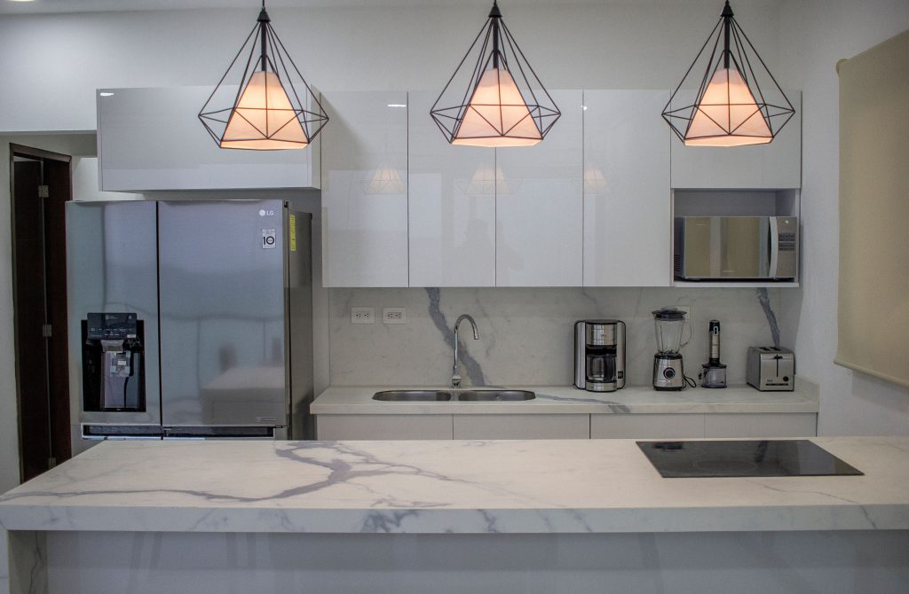 pexels photo 18039822 18039822 Sleek and contemporary kitchen featuring marble countertops and stylish lighting.